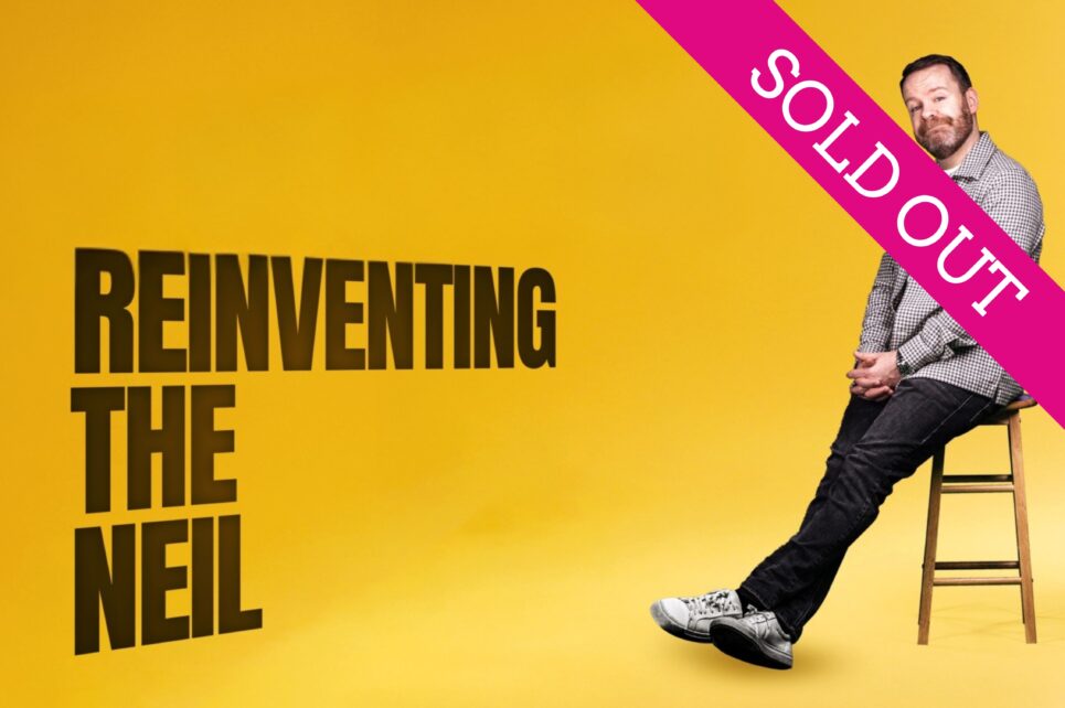 Neil Delamere sitting in a chair