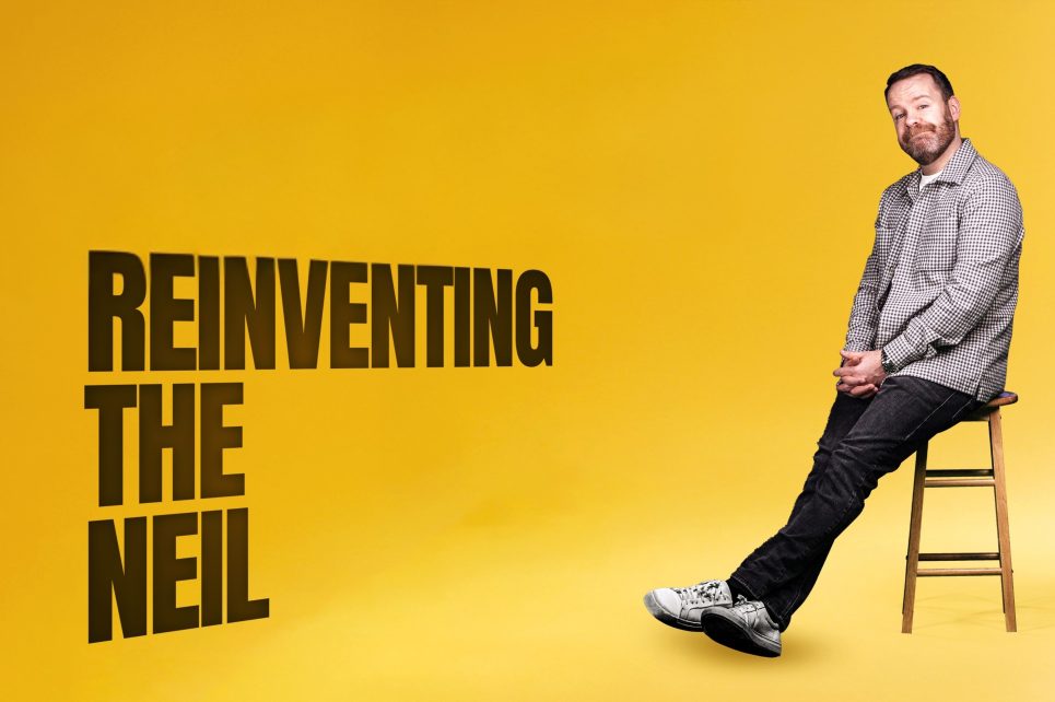 Neil Delamere sitting in a chair