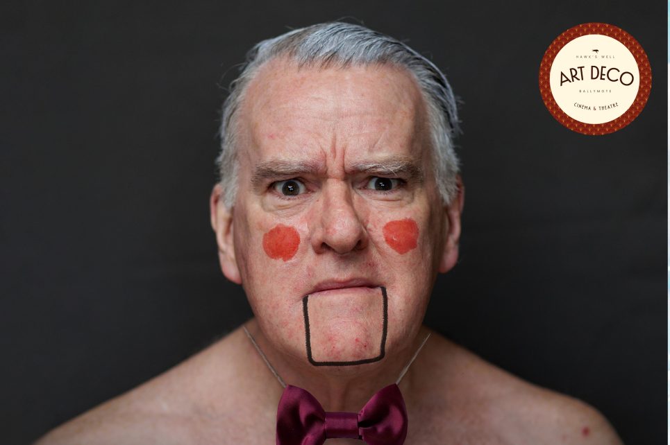 Mikel Murfi looks like a puppet with painted cheeks and a drawn-on jaw.