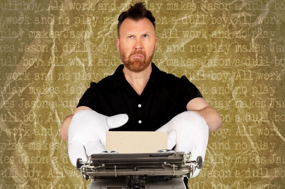 Comedian Jason Byrne wearing white gloves typing on a typewriter Comedian Jason Byrne wearing white gloves typing on a typewriter