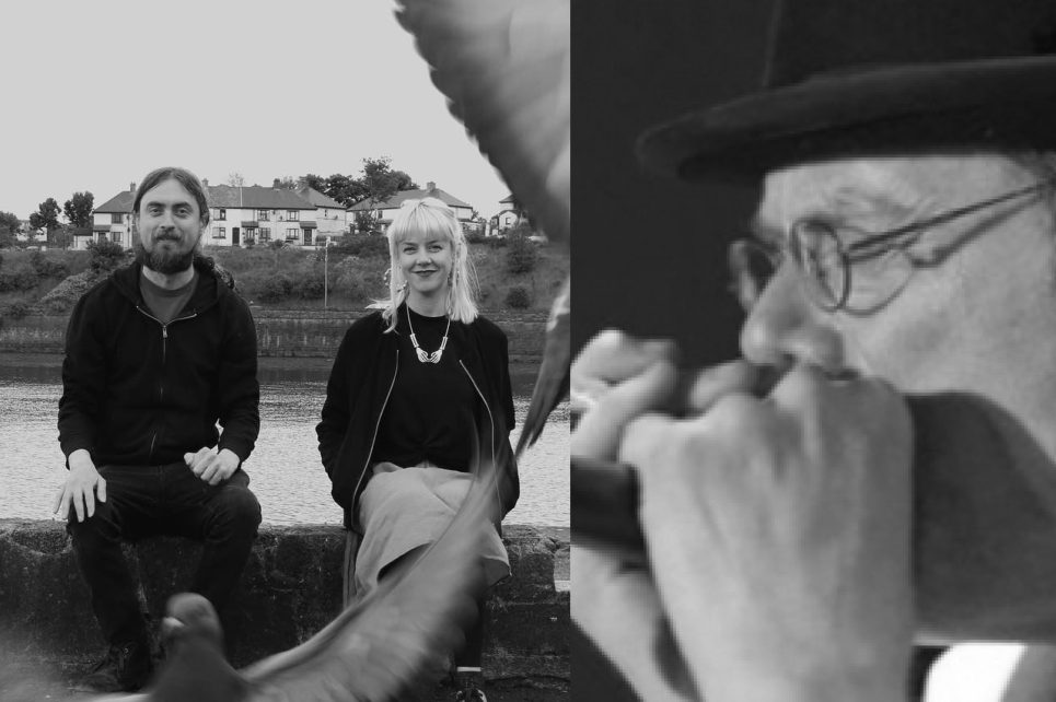 Musicians by river with pigeon in foreground. Musicians by river with pigeon in foreground.