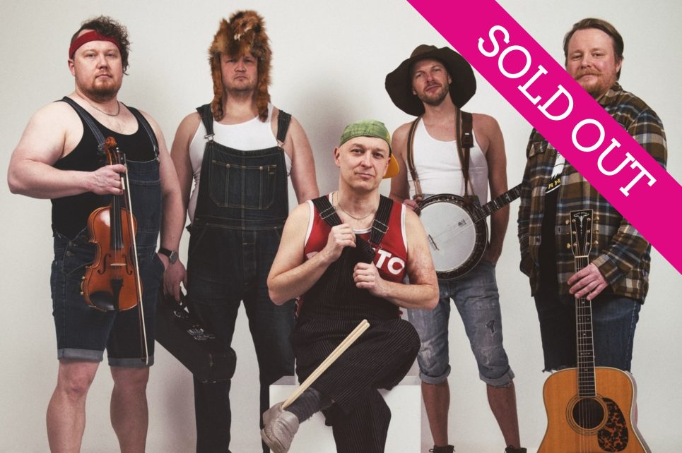 Band members standing with their instruments