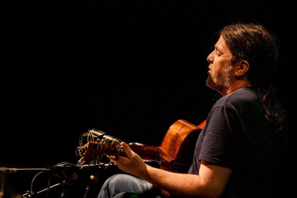 A profile photo of Seamie O'Dowd playing guitar A profile photo of Seamie O'Dowd playing guitar