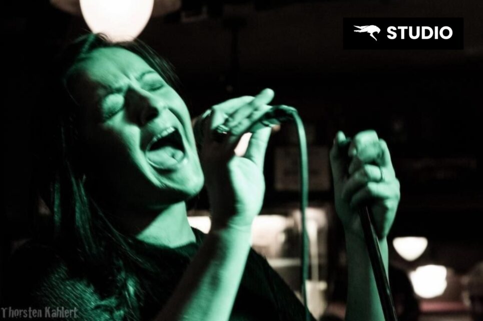 Woman singing into a microphone