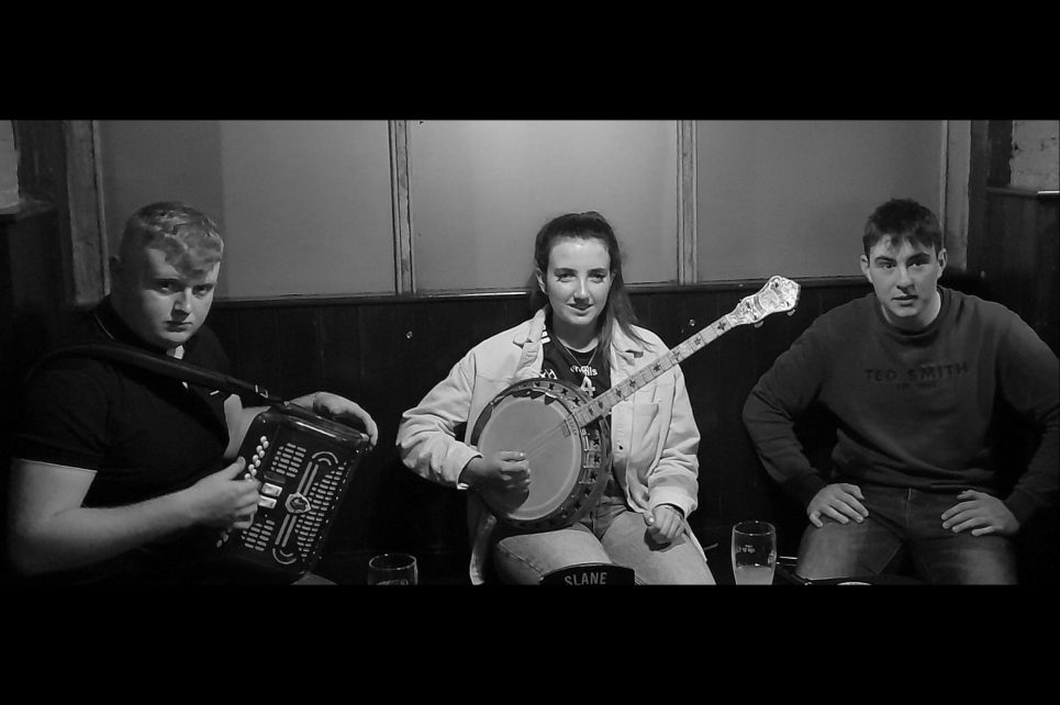 Musicians posing with their instruments.