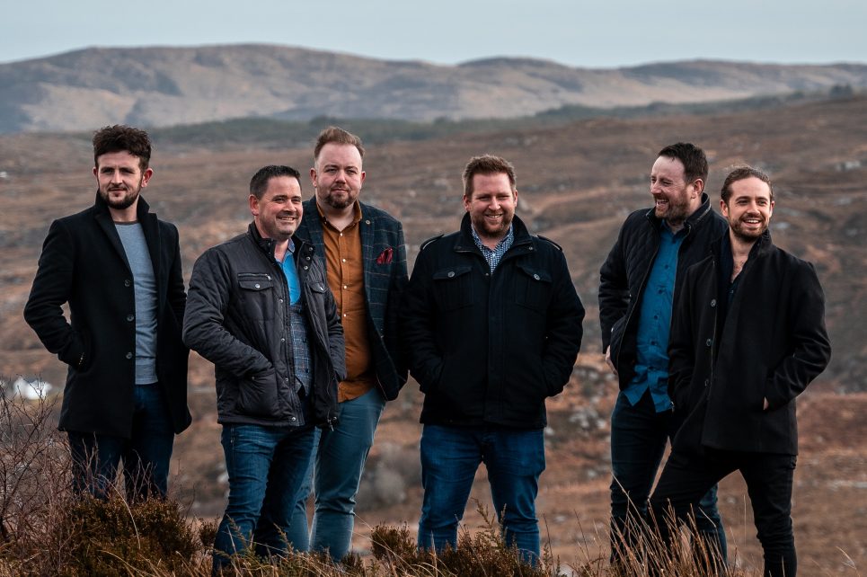 Six men standing in a field