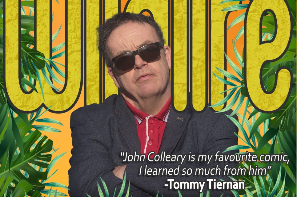 A poster of John Colleary wearing sunglasses, with bold yellow text reading “Wildfire” in the background