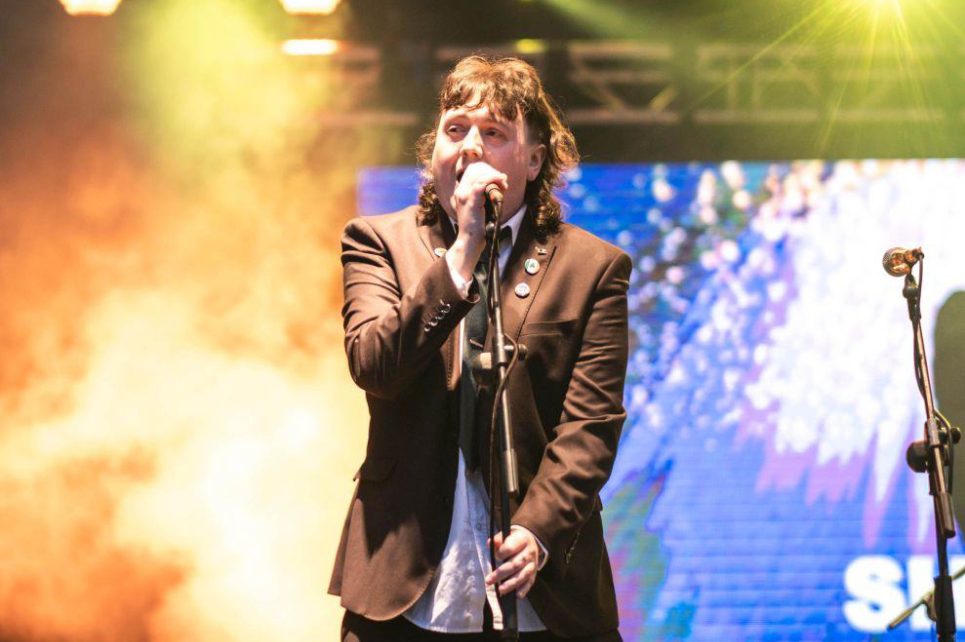 A photograph of Eamonn Mullarkey singing