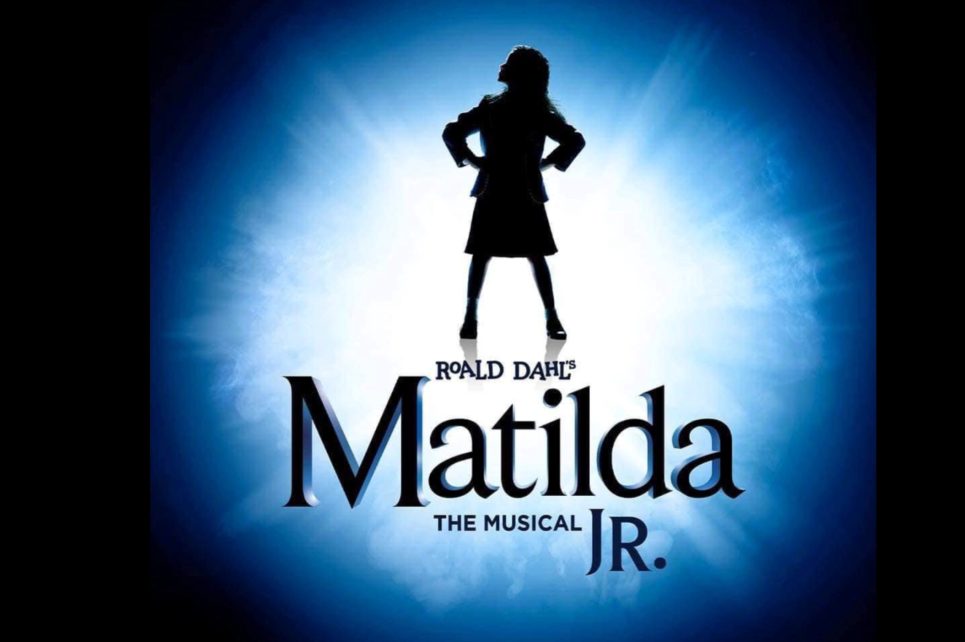 A silhouette of a girl at the centre of a blue burst 